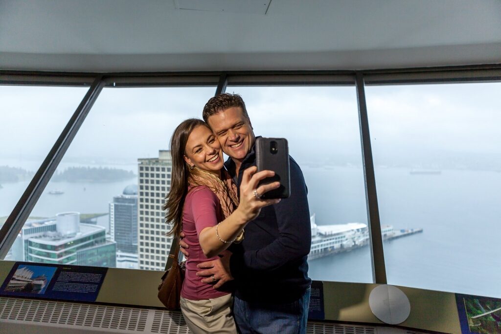Couple taking a selfie from Vancouver Lookout Tower
