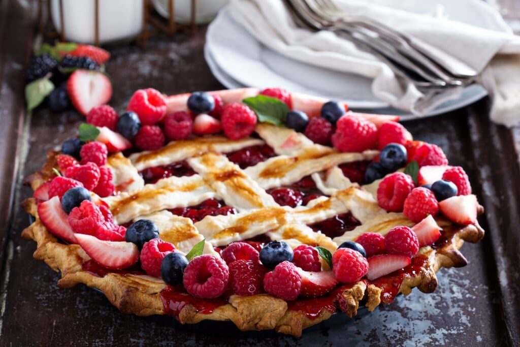 Decadent pie garnished with assorted berries