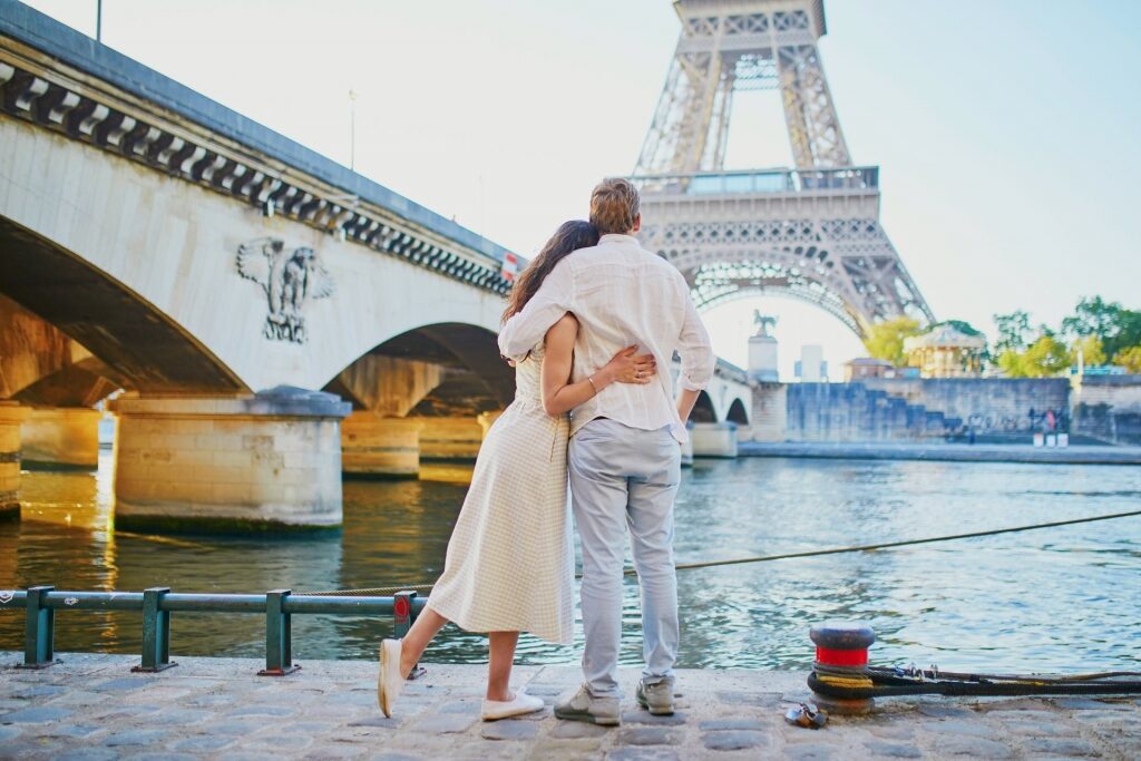 Couple hugging near Eiffel Tower, Paris