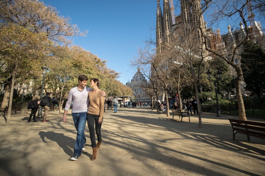 Couple walking the streets near Sagrada Familia