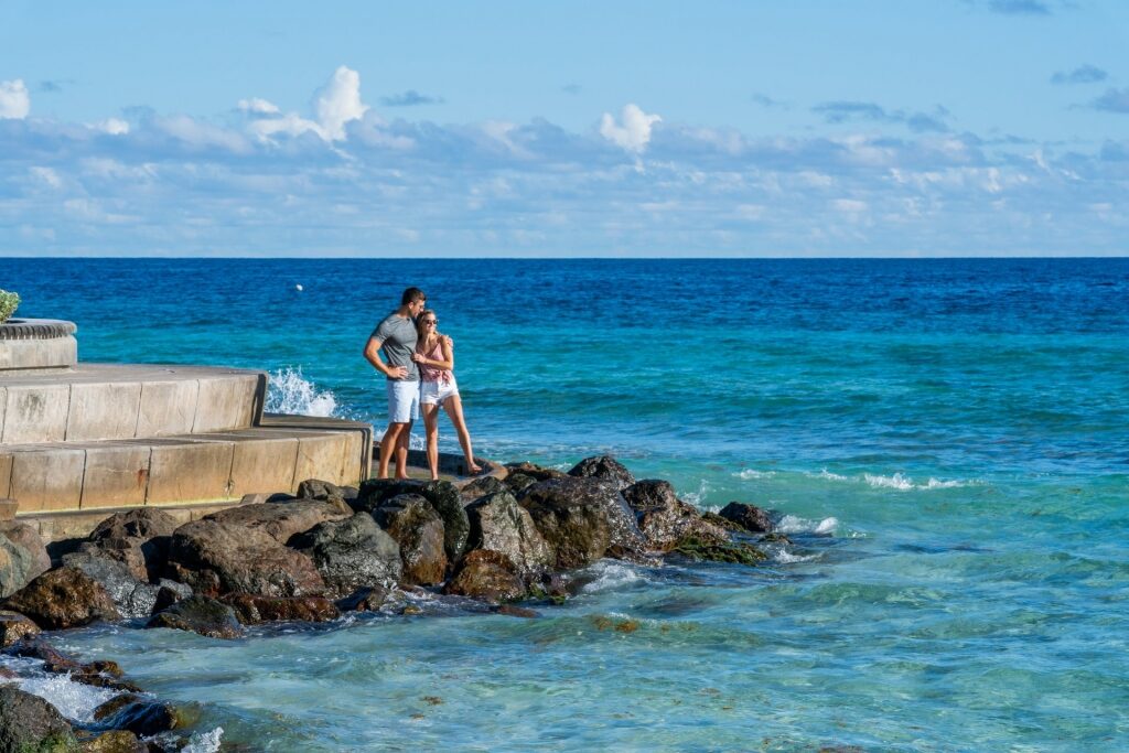 Couple on a rocky shore in Barbados