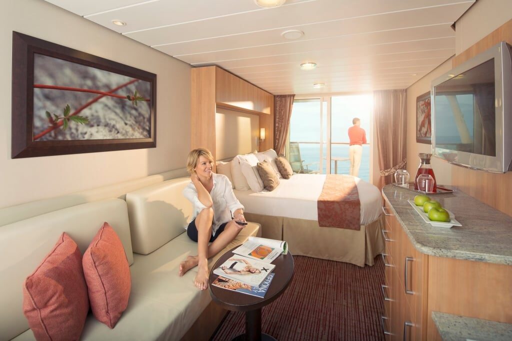 Woman relaxing inside Celebrity stateroom
