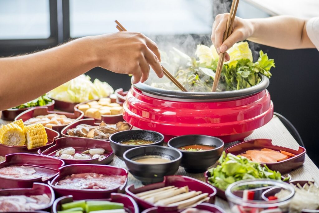 People preparing shabu shabu pot will convince you to add it in what to eat in japan list