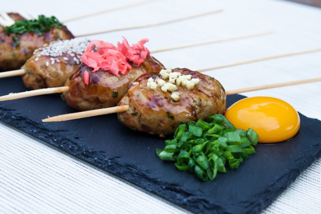Yakitori meatball sticks may be underrated when it comes to what to eat in japan