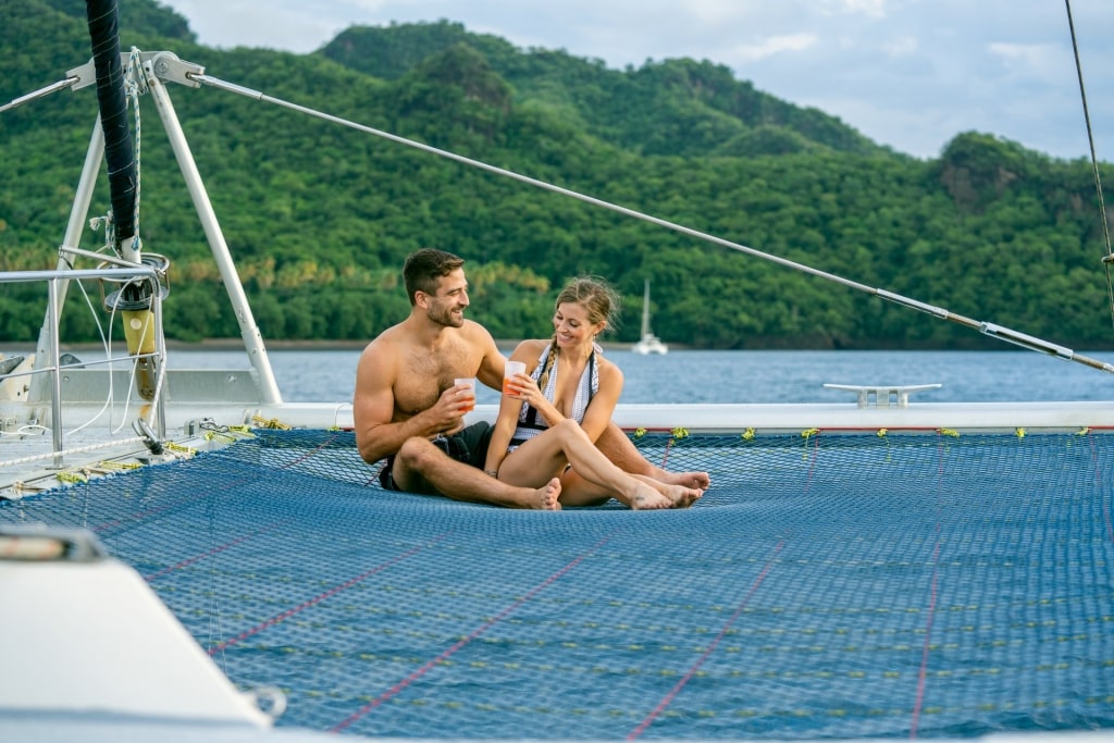 Couple relaxing on a catamarna