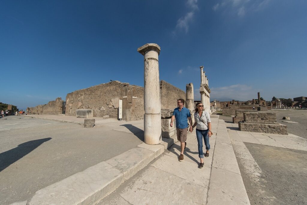 Couple wandering around the historic site of Pompeii