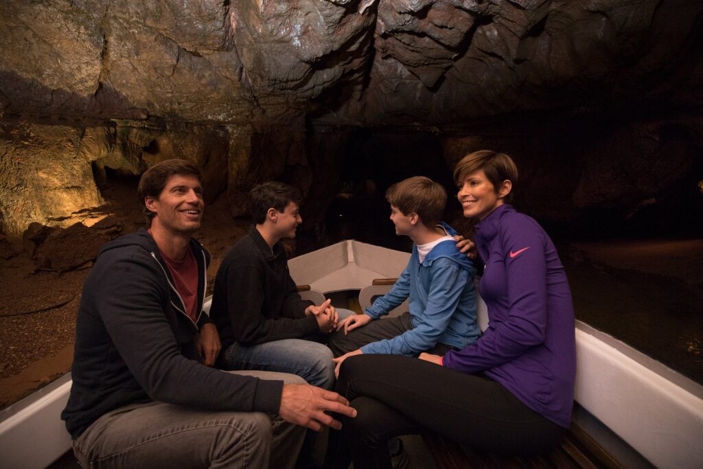 Family on a boat touring a cave in Spain