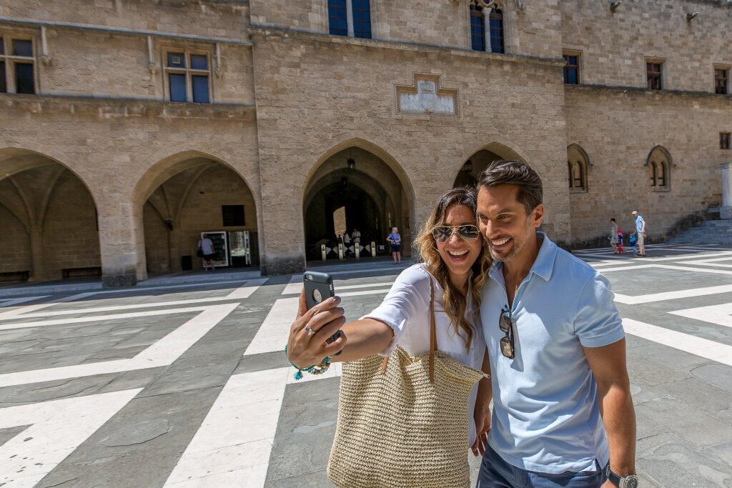 Couple taking a selfie in the streets of Rhodes