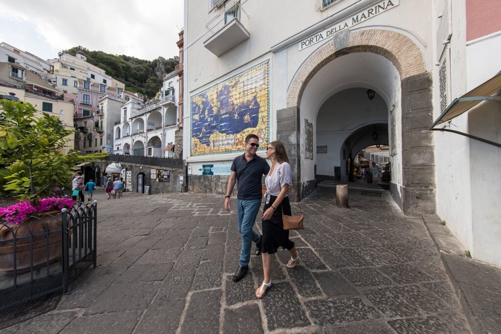 Couple in semi formal wear walking casually in Amalfi Coast