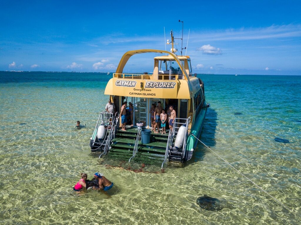People on a boat excursion in Stingray City, Grand Cayman