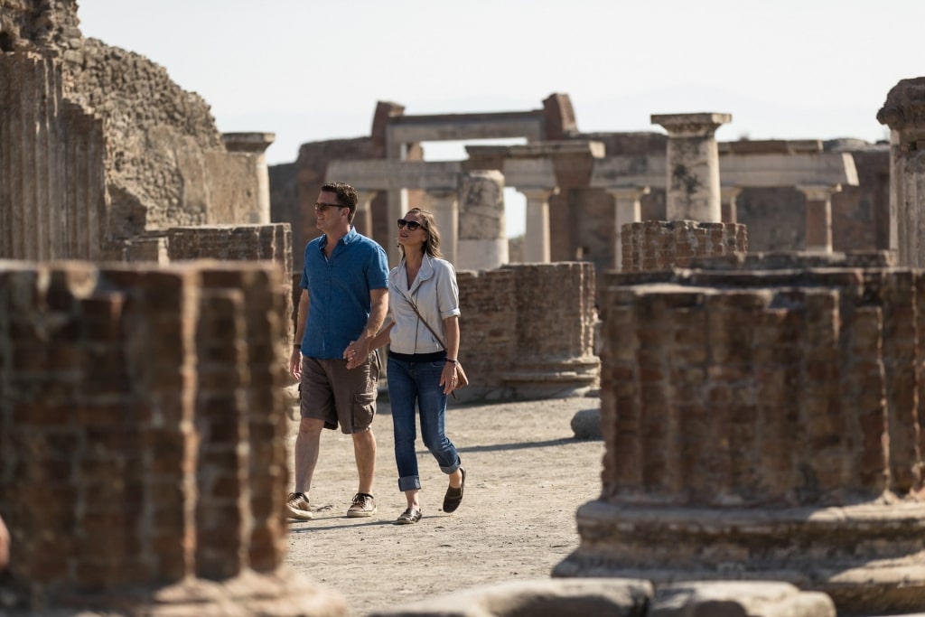 Couple exploring the historical site of Pompeii