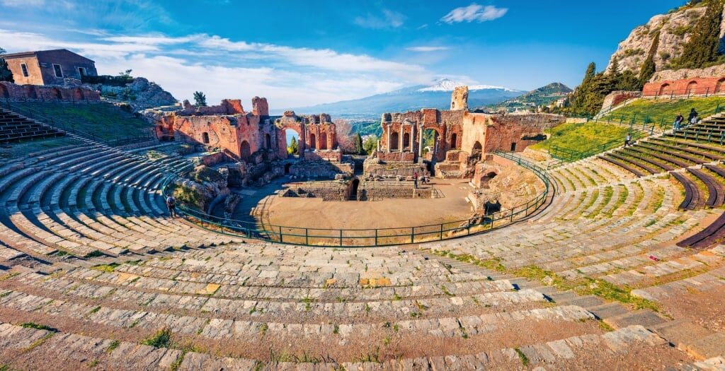 Historical Roman theater with Mt Etna as backdrop 