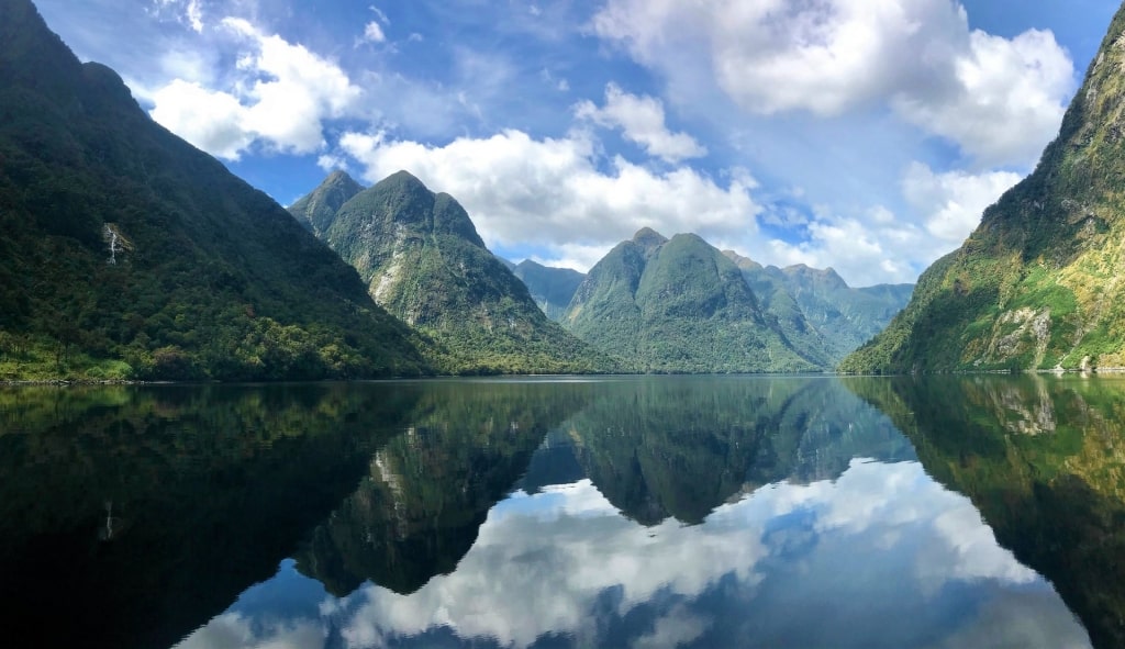 Beautiful landscape of Doubtful Sound reflecting on waters