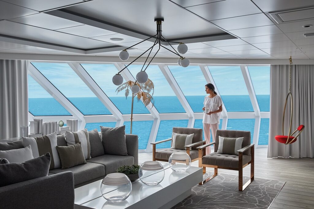 Woman enjoying the view inside Celebrity suite