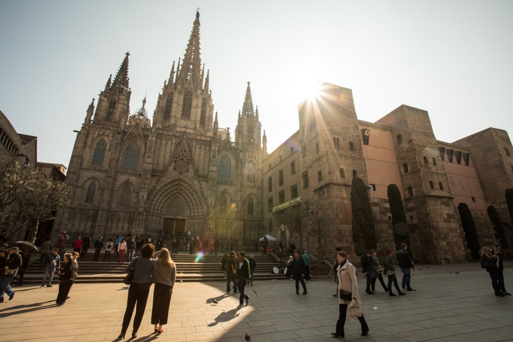 People walking along Sagrada Familia in Barcelona