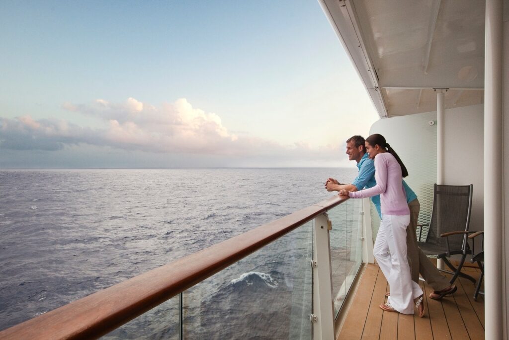 Couple hanging out on a cruise balcony