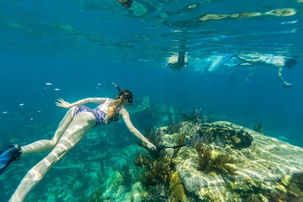 Woman snorkeling around shipwreck in Bermuda