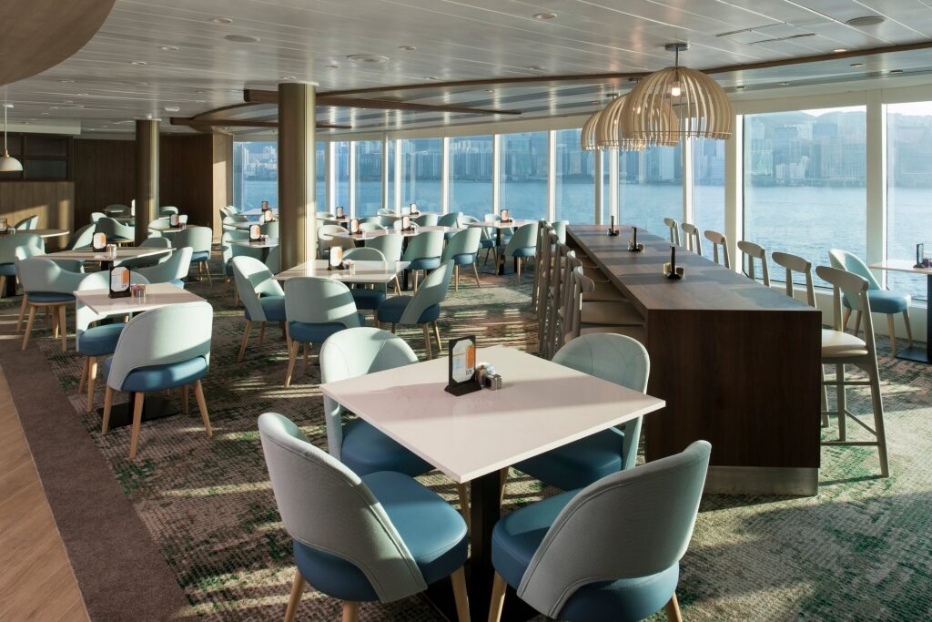 Elegant interior of Oceanview Cafe on Celebrity with huge glass windows