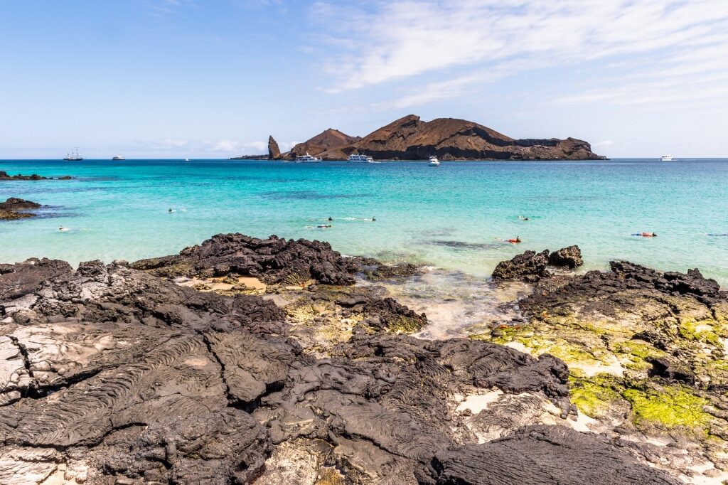 Rocky shore with turquoise waters of Santiago Island