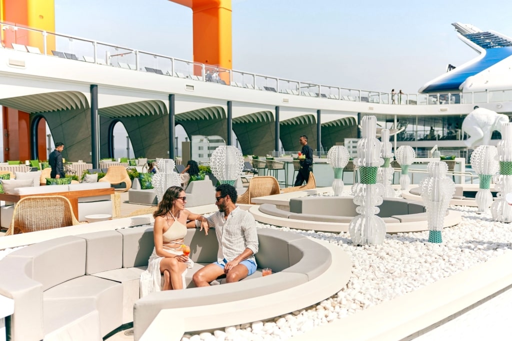 Couple relaxing on Celebrity Cruises Resort Deck