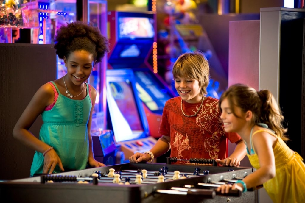 Kids playing foosball