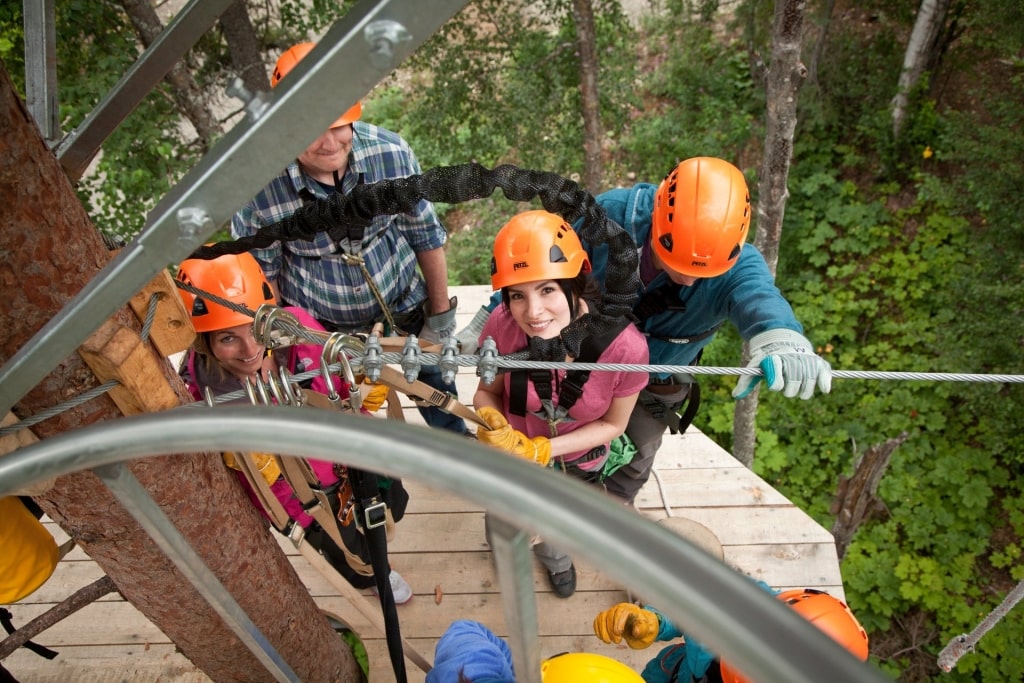 People preparing for a zipline activity