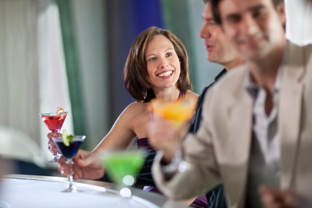 Woman chatting over cocktails at a bar