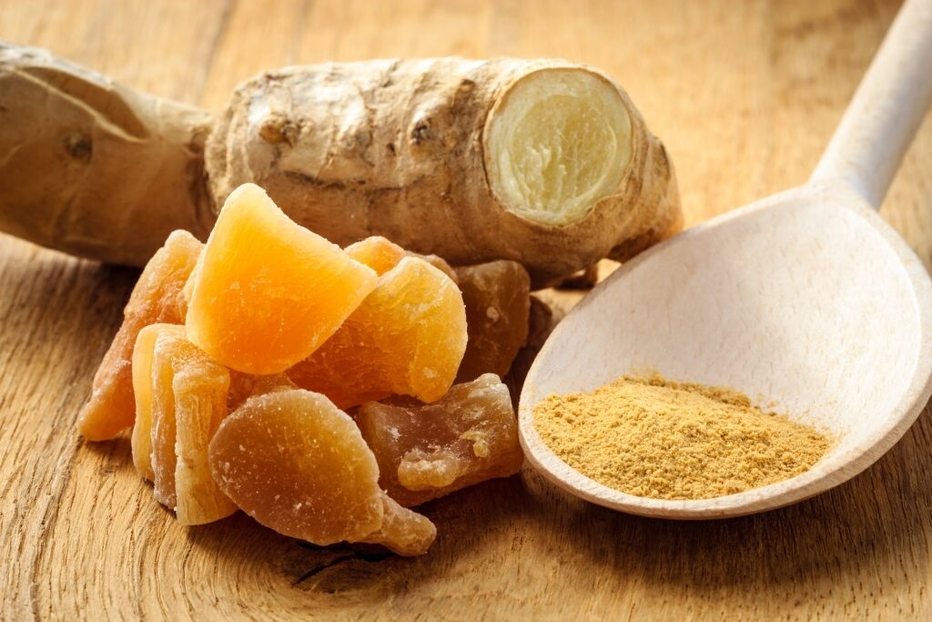 Close up view of ginger including powdered and candies form 