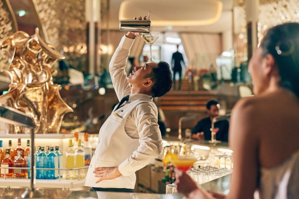 Bartender putting on a show at the Martini Bar