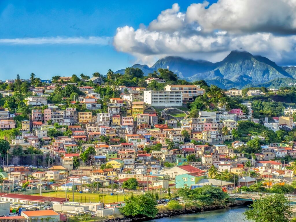 Colorful houses in Fort-de-France, Martinique with mountain backdrop