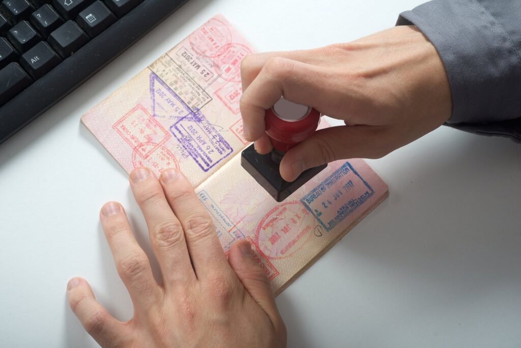 Man stamping a passport