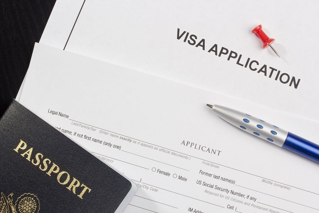 Visa application papers including a passport
