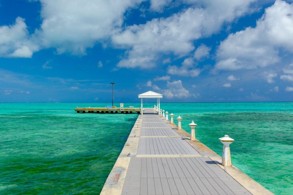 Relaxing view of boardwalk with turquoise waters at The Caribbean 