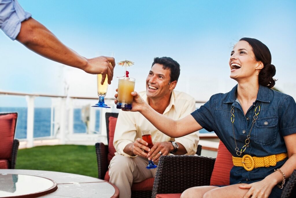 Friends enjoying premium drinks onboard Celebrity Cruises
