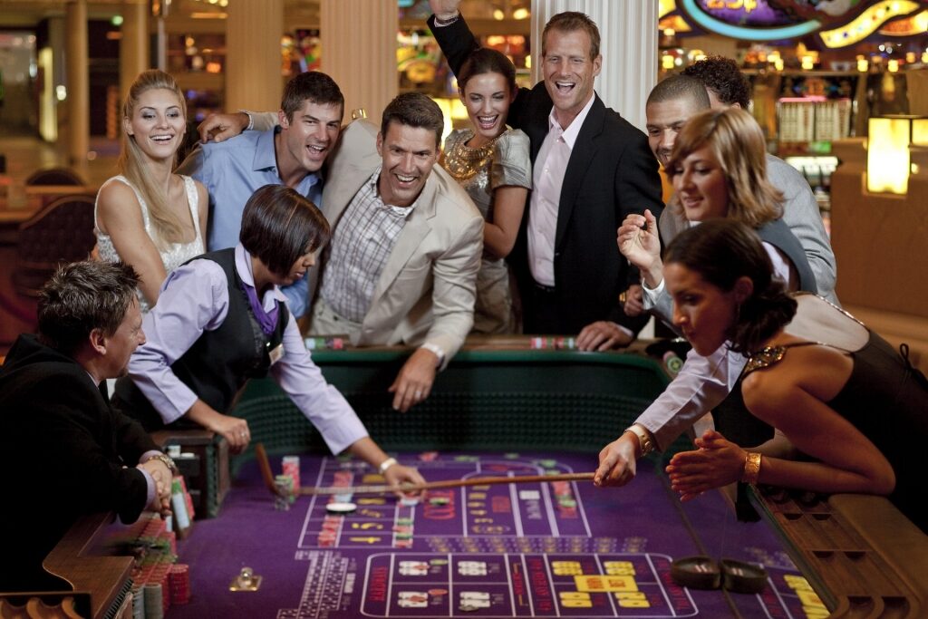 Guests playing and using onboard cruise credit in the casino