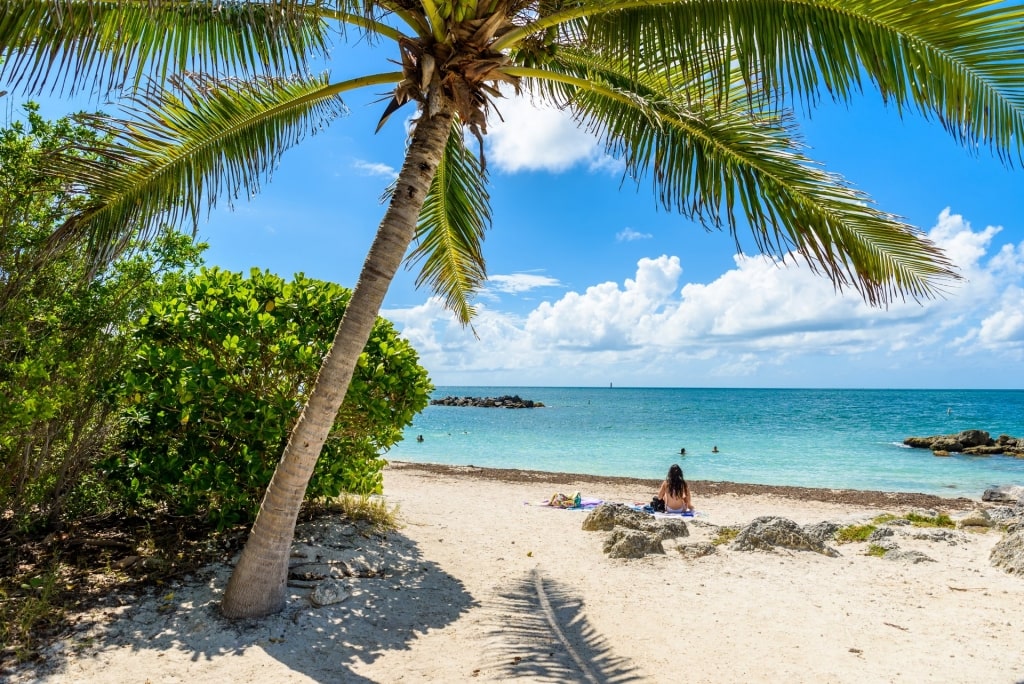 Girl looking at the clear blue waters of Fort Zachary Taylor Park