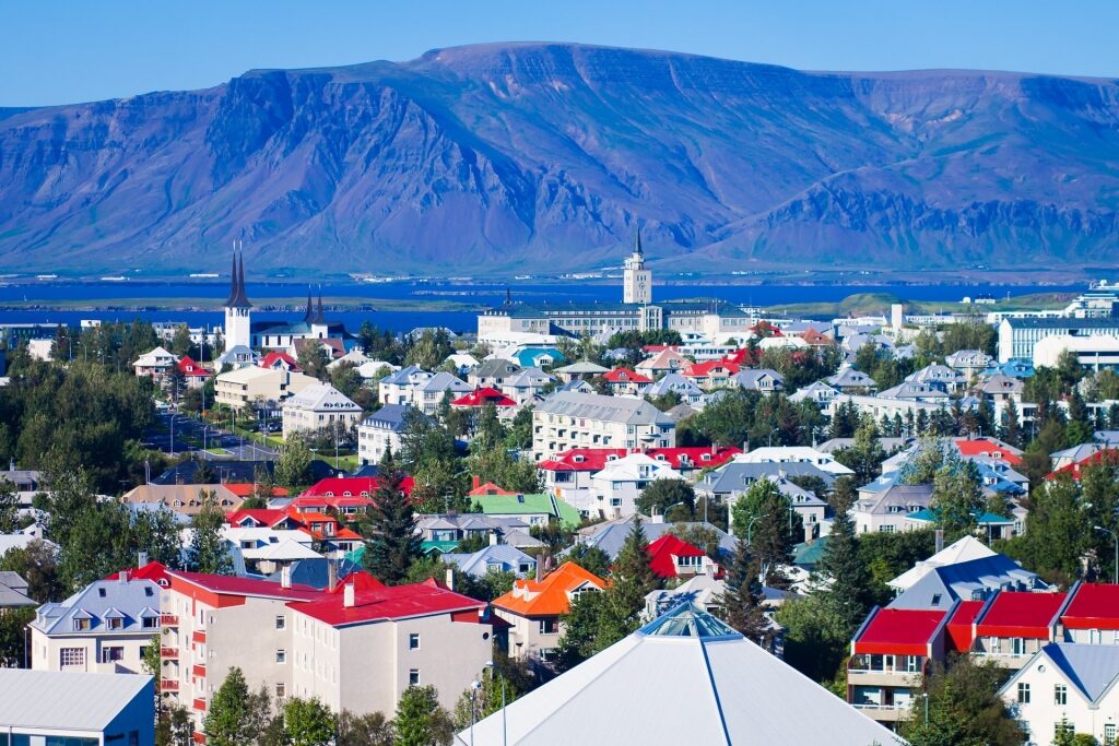 Picturesque landscape of Reykjavik, Iceland including houses and mountain as backdrop
