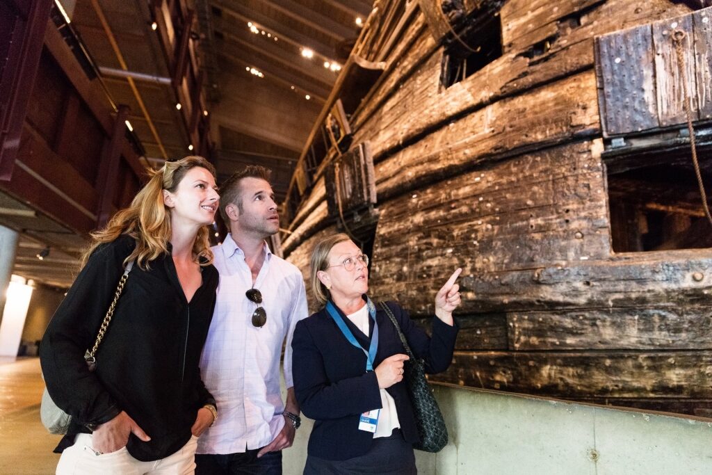 Couple on a guided tour inside Vasa Museum