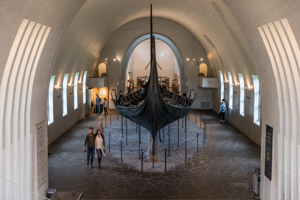 Couple wandering inside Viking Ship Museum