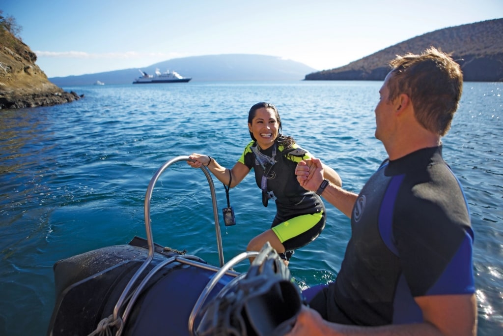 Couple preparing to snorkel in the Galapagos