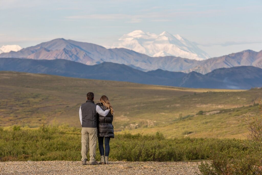 Couple looking at the greenery of Denali National Park, Alaska