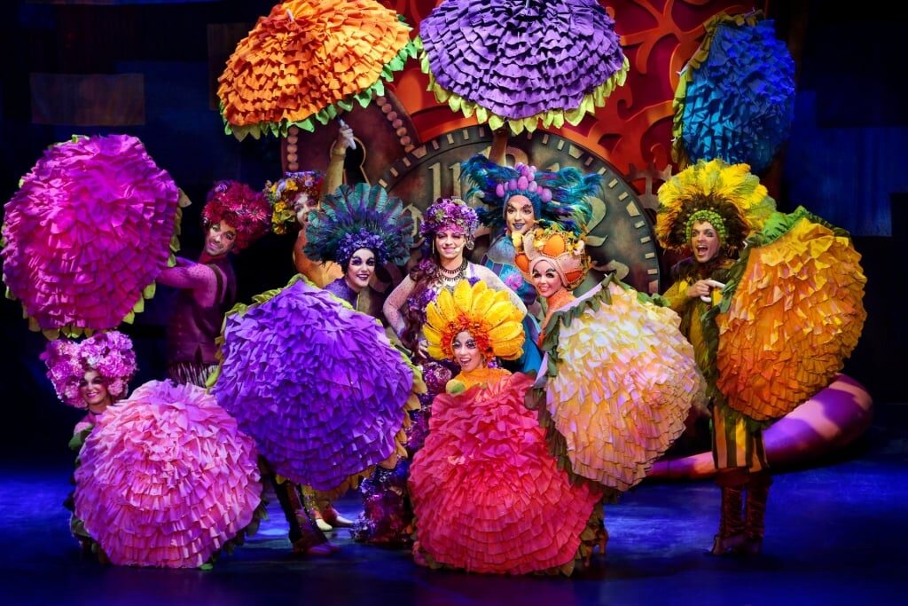 Celebrity Cruises onboard entertainment features performers with colorful costumes