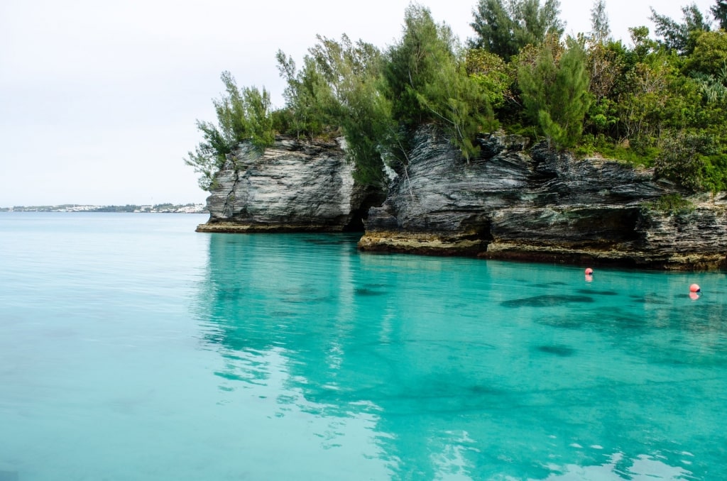 Turquoise waters and rocky shore of Admiralty House Park