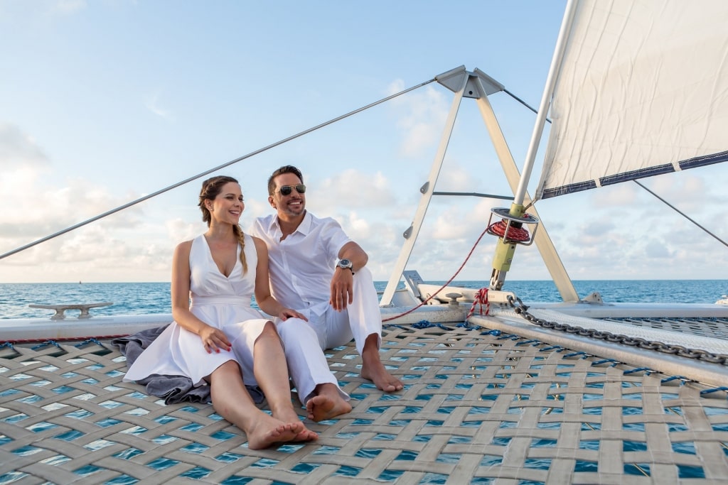 Couple sitting on a catamaran