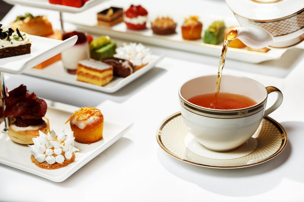 Table with tea and miniature pastries