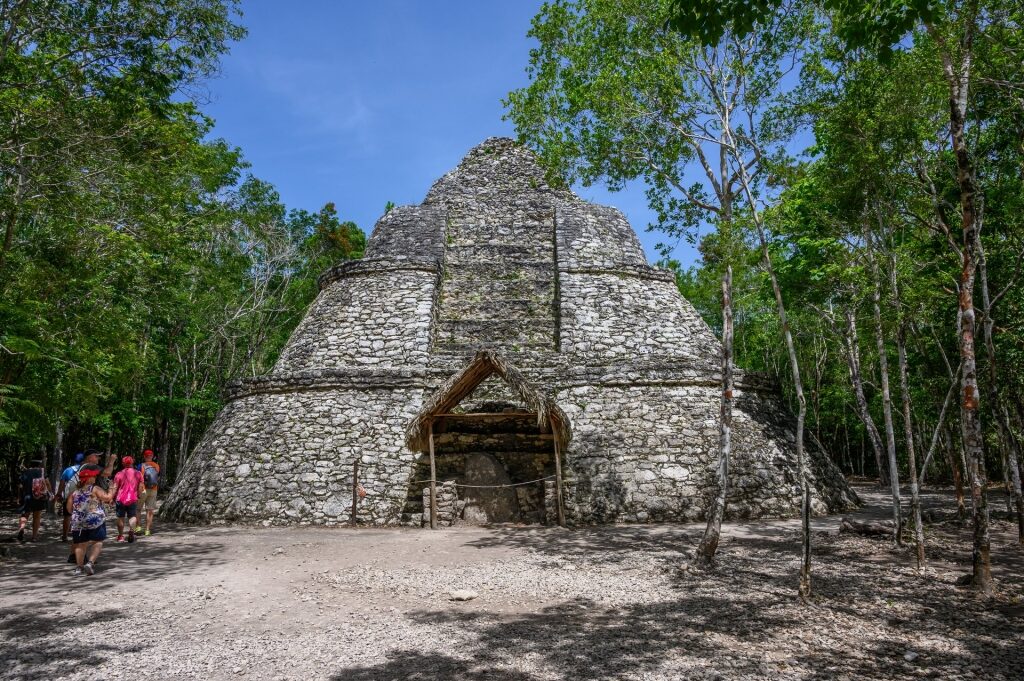 Tourists sightseeing in Coba Mayan Ruins, Mexico