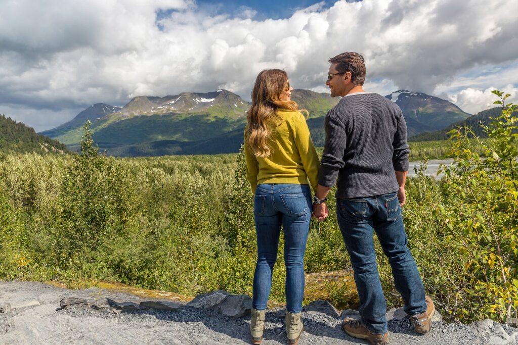 Couple looking at the beautiful landscape in Alaska