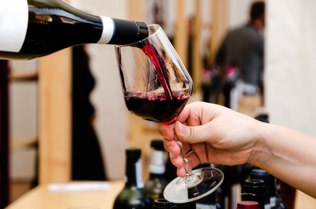 Barolo wine being poured in a glass