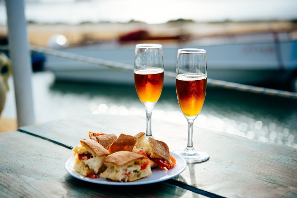 Glasses of Marsala wine served with Sicilian snacks 