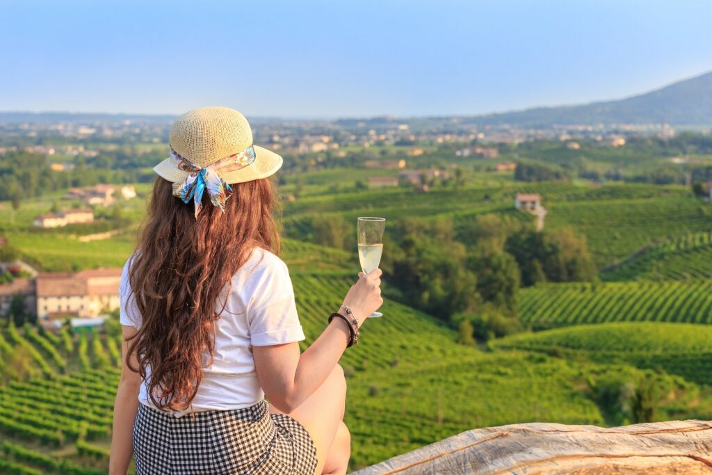 Woman enjoying a glass of Prosecco Italian wine